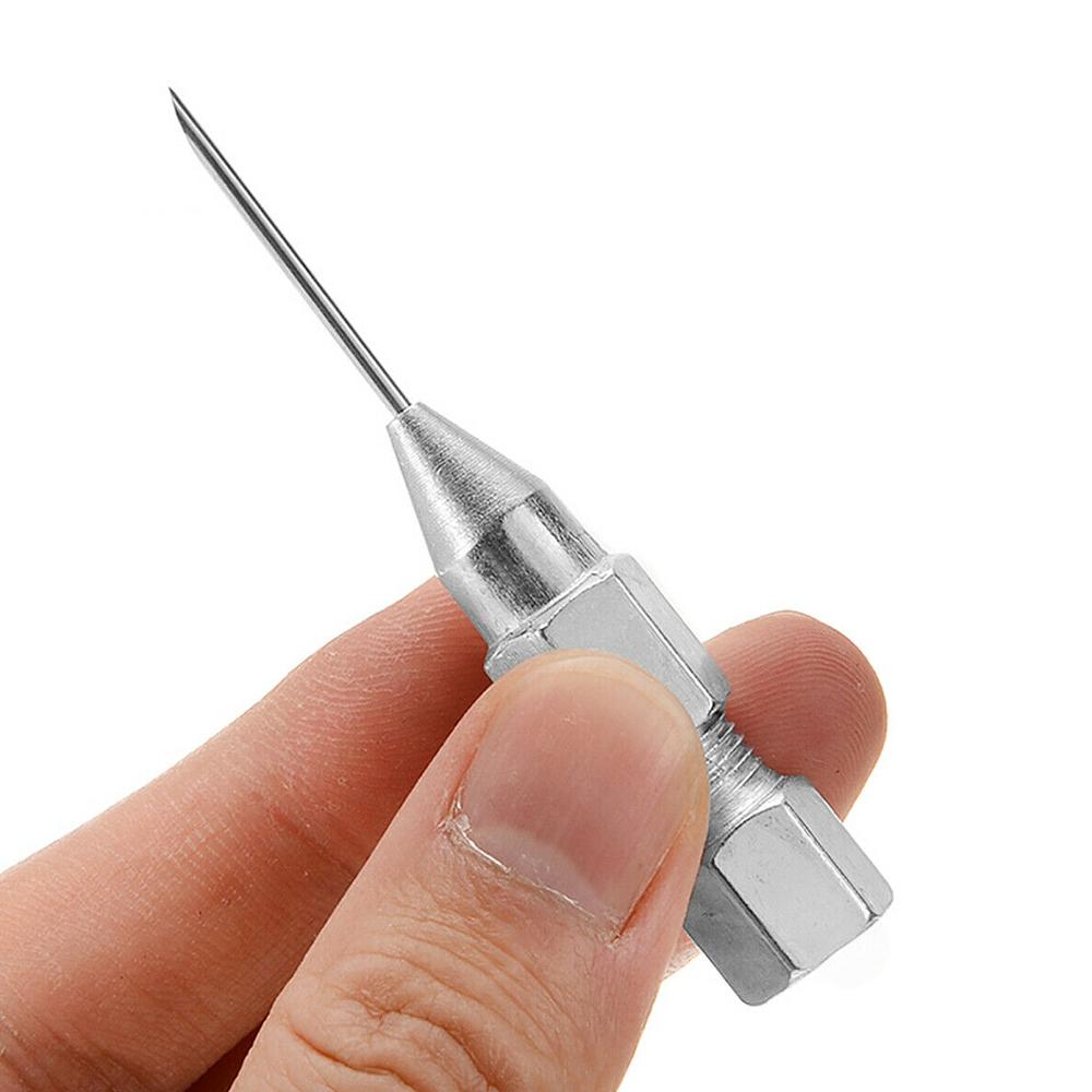 Grease GUN Needle Tip OF The Mouth